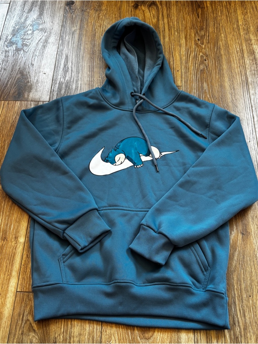 Teal Pullover Hoodie with White Swoosh and Sleeping Creature - Picture 2 of 9